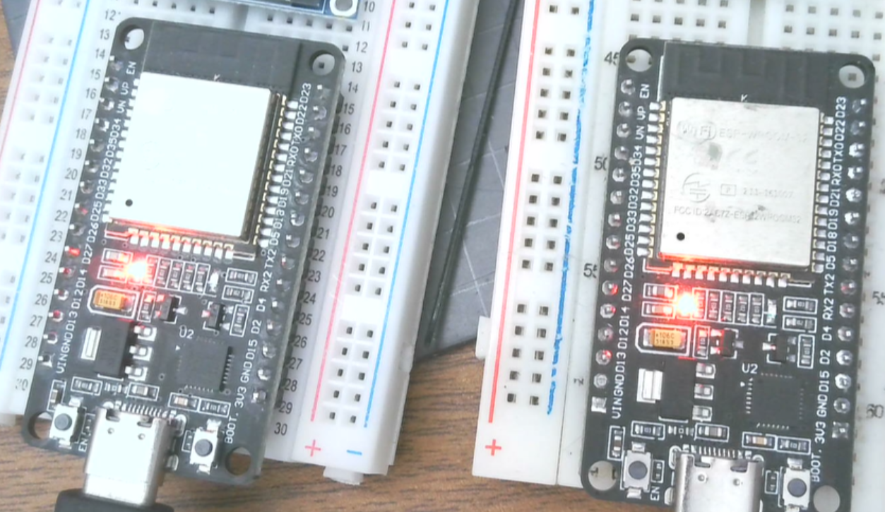 Two generic ESP32 devkit boards on breadboards